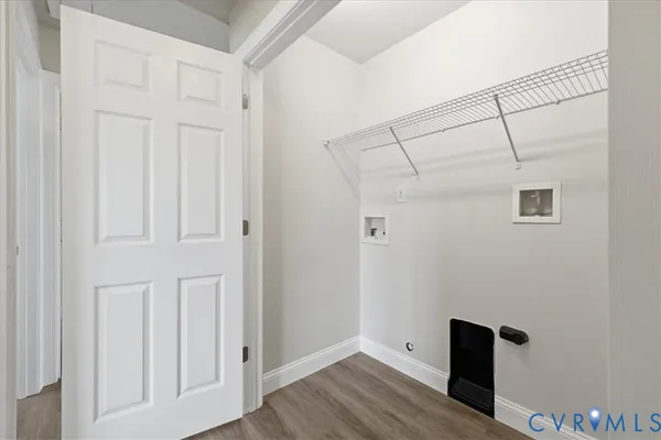a view of a room with wooden floor