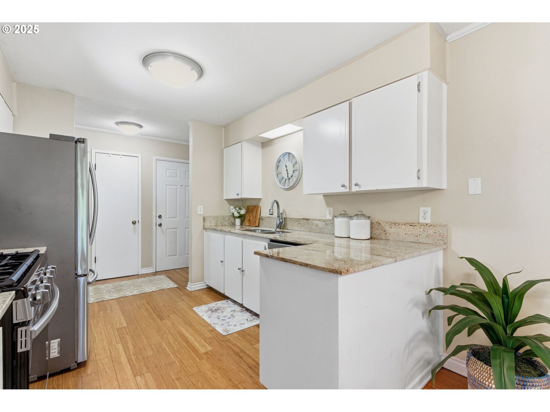 6745 Southwest Scholls Ferry Road, Unit 29 Beaverton, OR 97008 - Photo 15 of 31 a kitchen with a sink and refrigerator