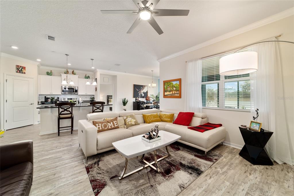 9238 Southwest 60th Terrace Road Ocala, FL 34476 - Photo 14 of 50 a living room with furniture and kitchen view