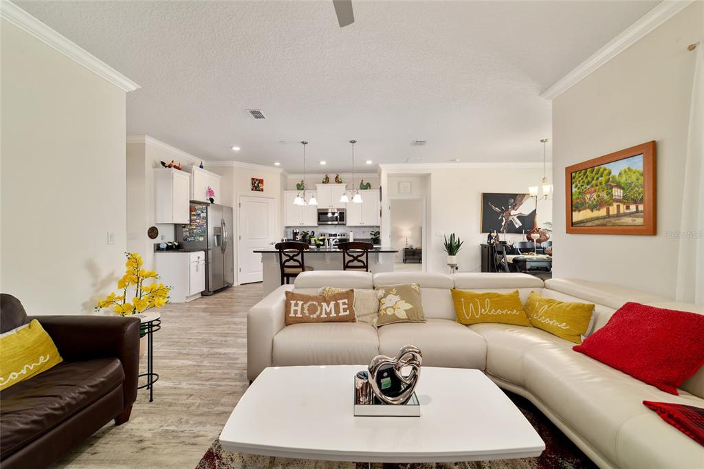 9238 Southwest 60th Terrace Road Ocala, FL 34476 - Photo 15 of 50 a living room with furniture kitchen view and a table