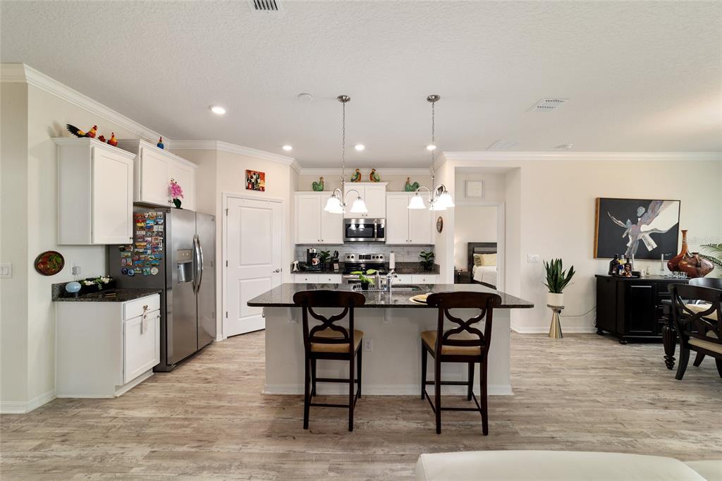 9238 Southwest 60th Terrace Road Ocala, FL 34476 - Photo 17 of 50 a kitchen with a table and chairs in it