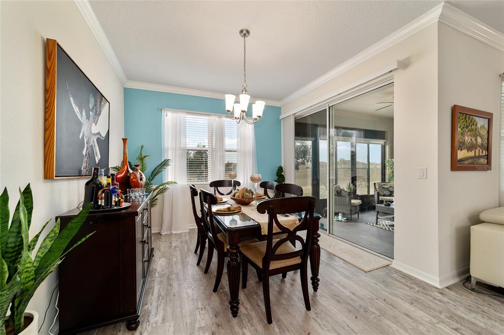 9238 Southwest 60th Terrace Road Ocala, FL 34476 - Photo 25 of 50 a view of a dining room with furniture and chandelier