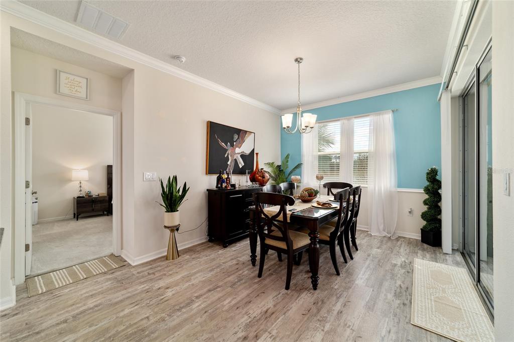 9238 Southwest 60th Terrace Road Ocala, FL 34476 - Photo 26 of 50 a view of a dining room with furniture window and wooden floor