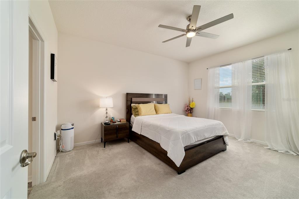 9238 Southwest 60th Terrace Road Ocala, FL 34476 - Photo 28 of 50 a bedroom with a bed and window