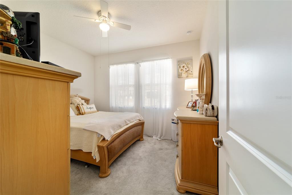 9238 Southwest 60th Terrace Road Ocala, FL 34476 - Photo 36 of 50 a bed room with a bed and a window