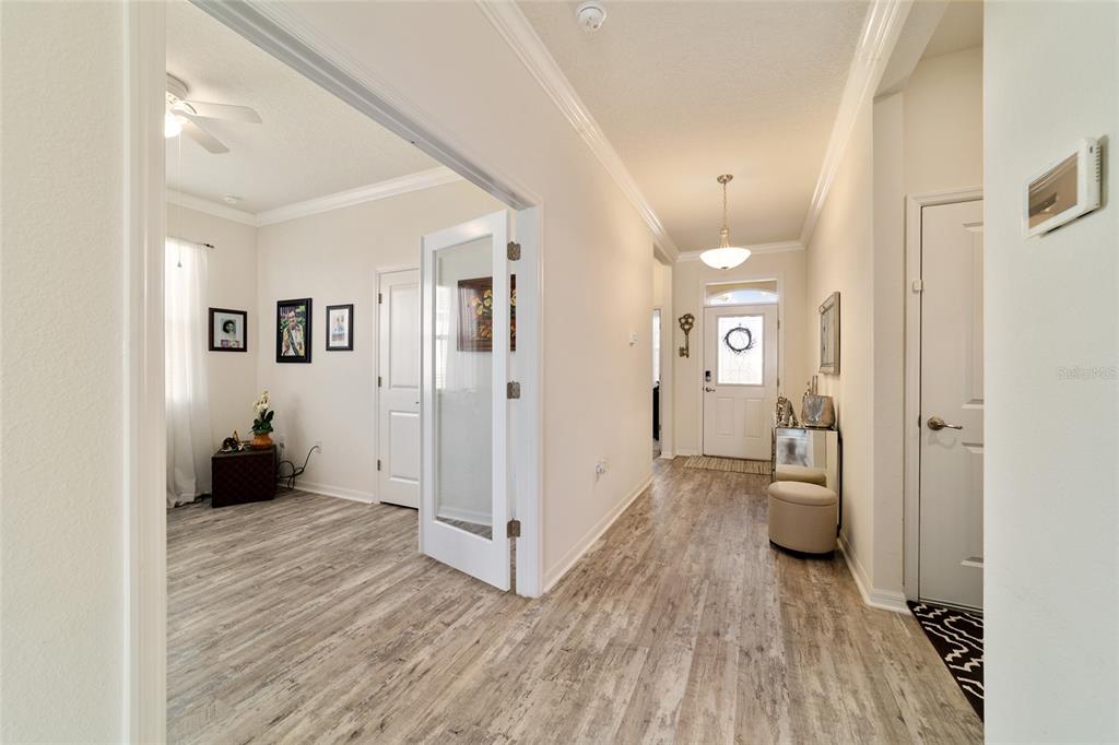 9238 Southwest 60th Terrace Road Ocala, FL 34476 - Photo 38 of 50 a view of a hallway with wooden floor and closet