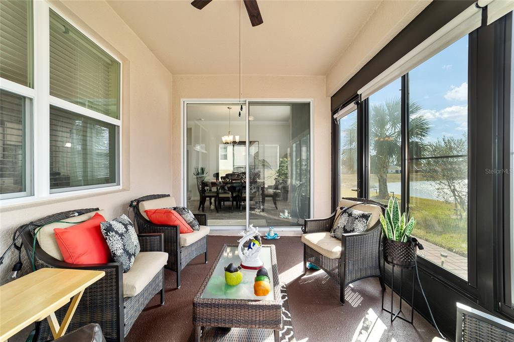 9238 Southwest 60th Terrace Road Ocala, FL 34476 - Photo 43 of 50 a living room filled with furniture and a floor to ceiling window