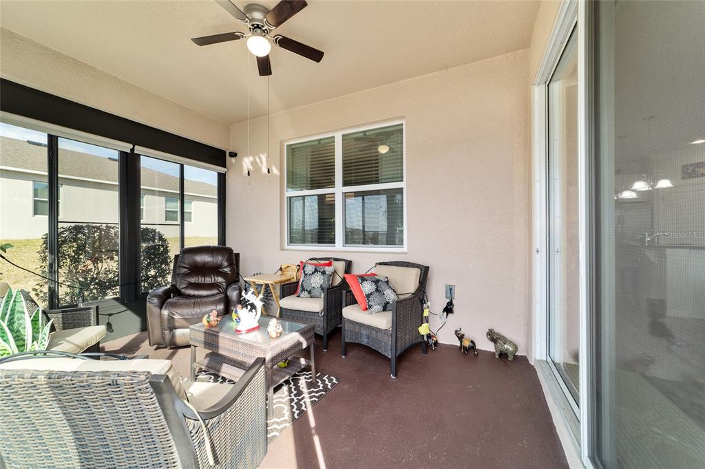 9238 Southwest 60th Terrace Road Ocala, FL 34476 - Photo 44 of 50 a living room with furniture and a large window