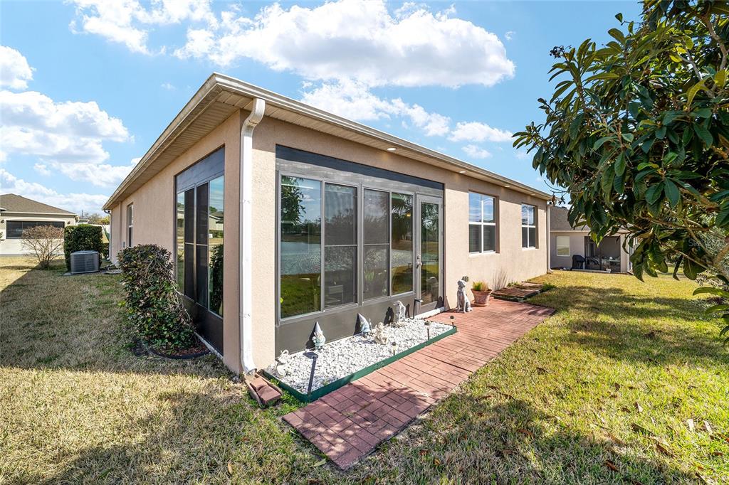 9238 Southwest 60th Terrace Road Ocala, FL 34476 - Photo 48 of 50 a view of house with backyard and glass windows