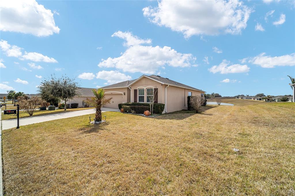 9238 Southwest 60th Terrace Road Ocala, FL 34476 - Photo 7 of 50 a house view with swimming pool and yard