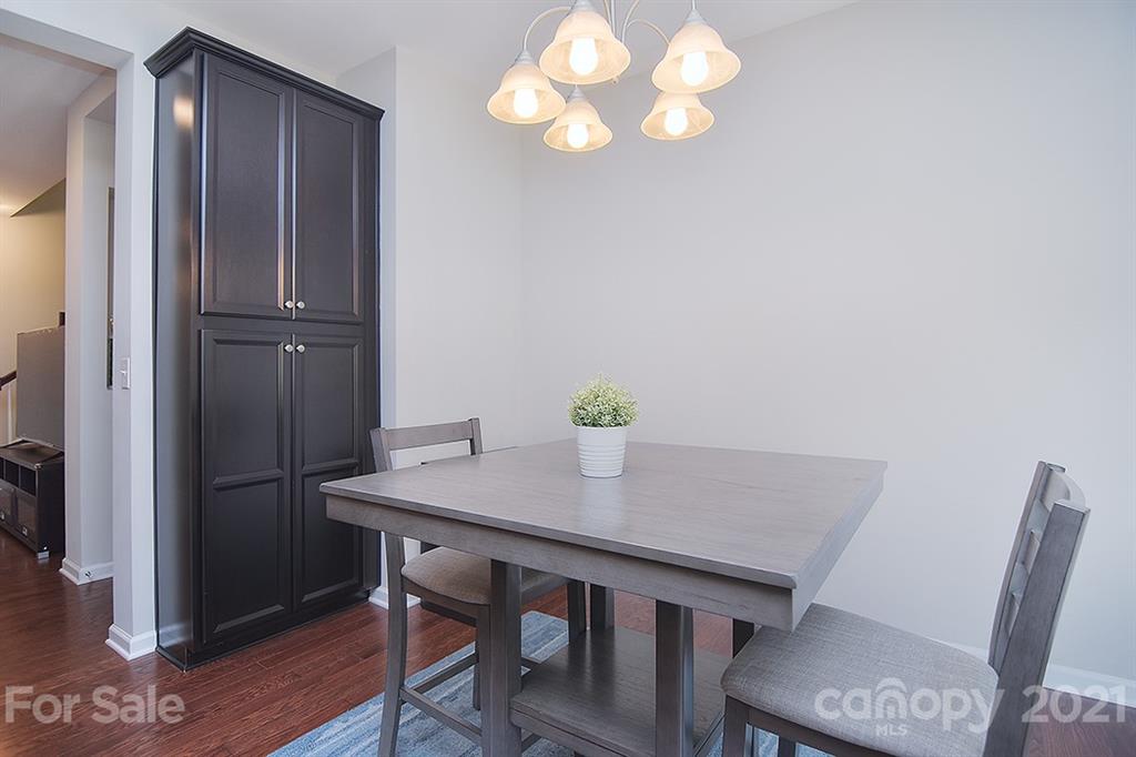 1411 Calum Way Fort Mill, SC 29708 - Photo 11 of 37 a view of a dining room with furniture and wooden floor
