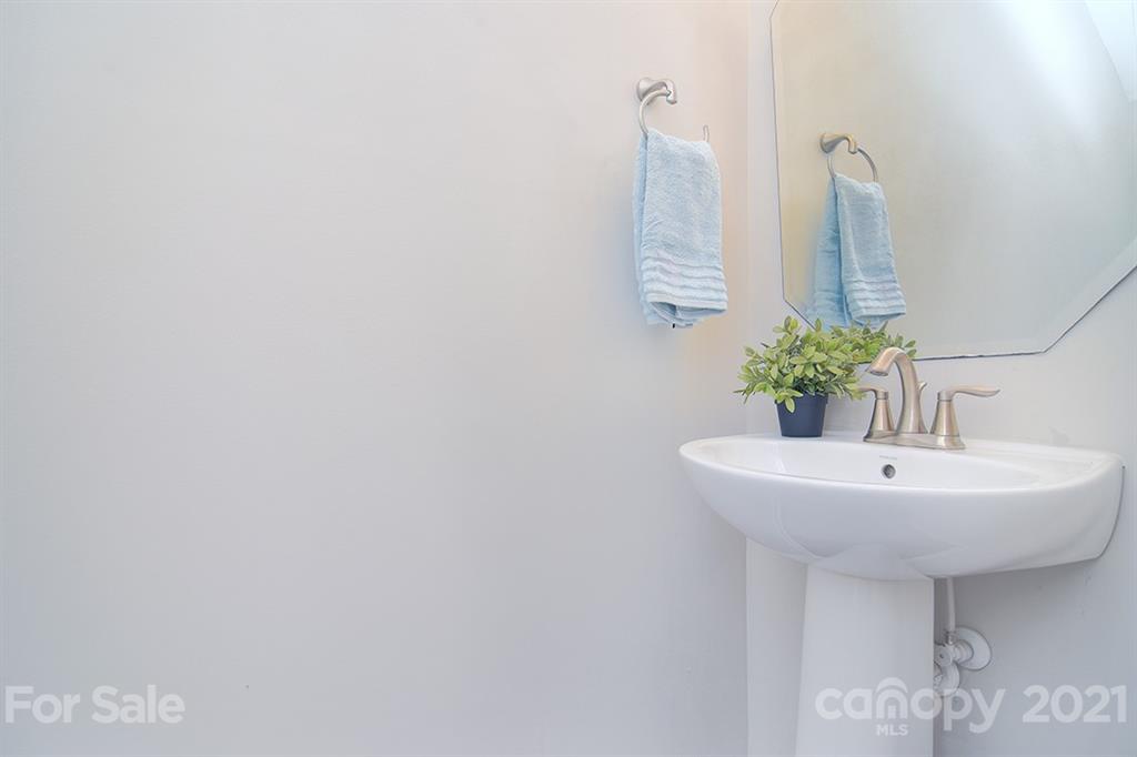 1411 Calum Way Fort Mill, SC 29708 - Photo 13 of 37 a bathroom with a sink and a mirror