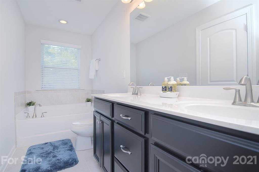 1411 Calum Way Fort Mill, SC 29708 - Photo 20 of 37 a bathroom with a sink and a bathtub