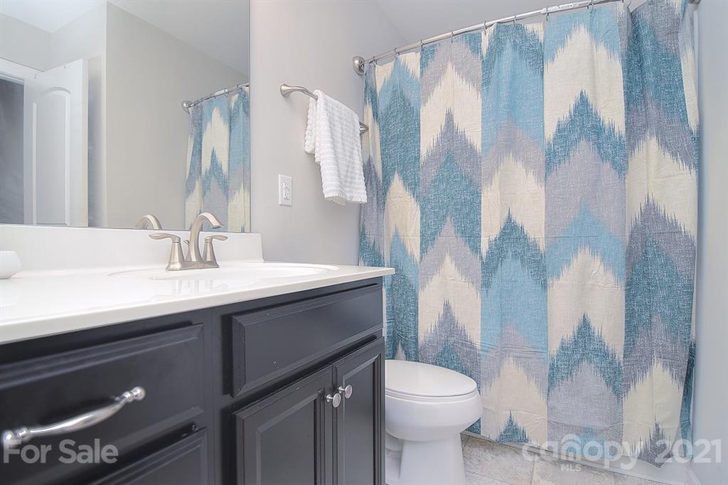 1411 Calum Way Fort Mill, SC 29708 - Photo 24 of 37 a bathroom with a sink toilet and shower
