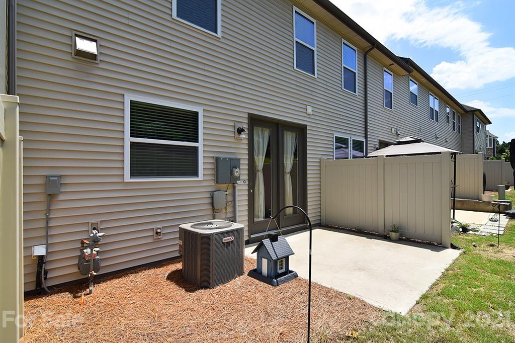 1411 Calum Way Fort Mill, SC 29708 - Photo 27 of 37 a backyard of a house with barbeque oven