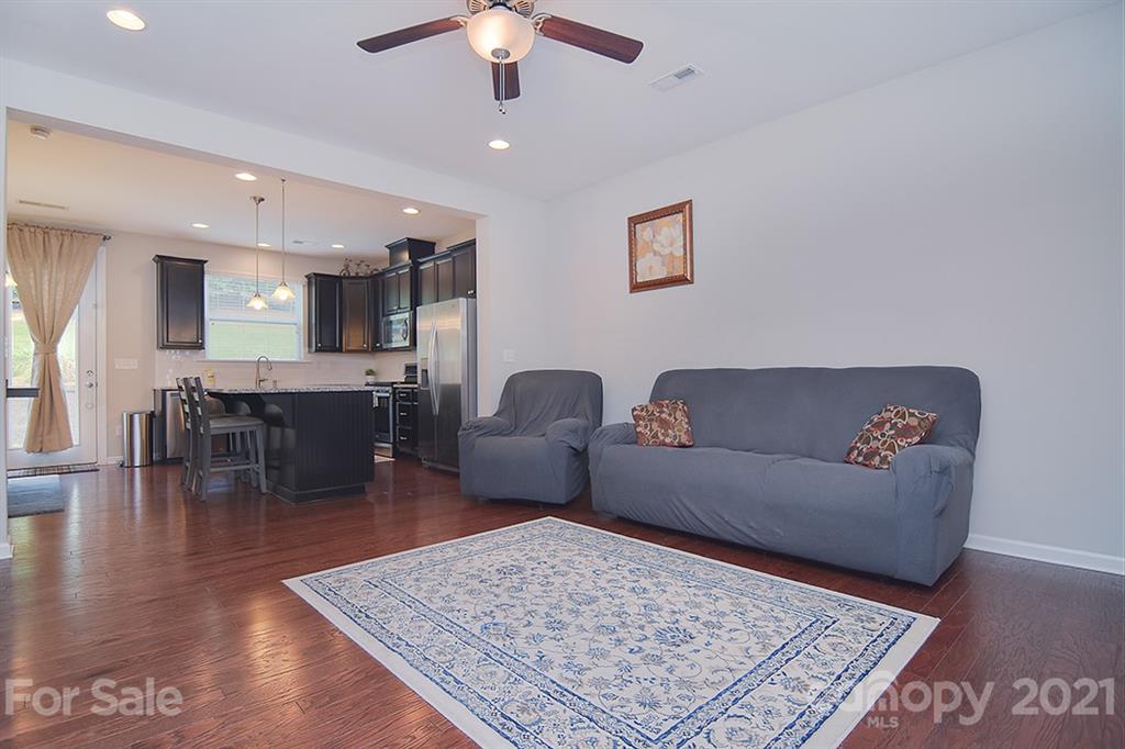 1411 Calum Way Fort Mill, SC 29708 - Photo 4 of 37 a living room with furniture and a wooden floor