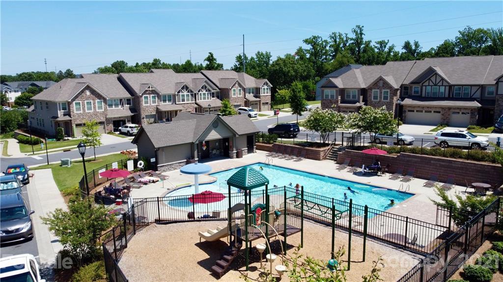 1411 Calum Way Fort Mill, SC 29708 - Photo 32 of 37 a aerial view of a house with swimming pool and furniture
