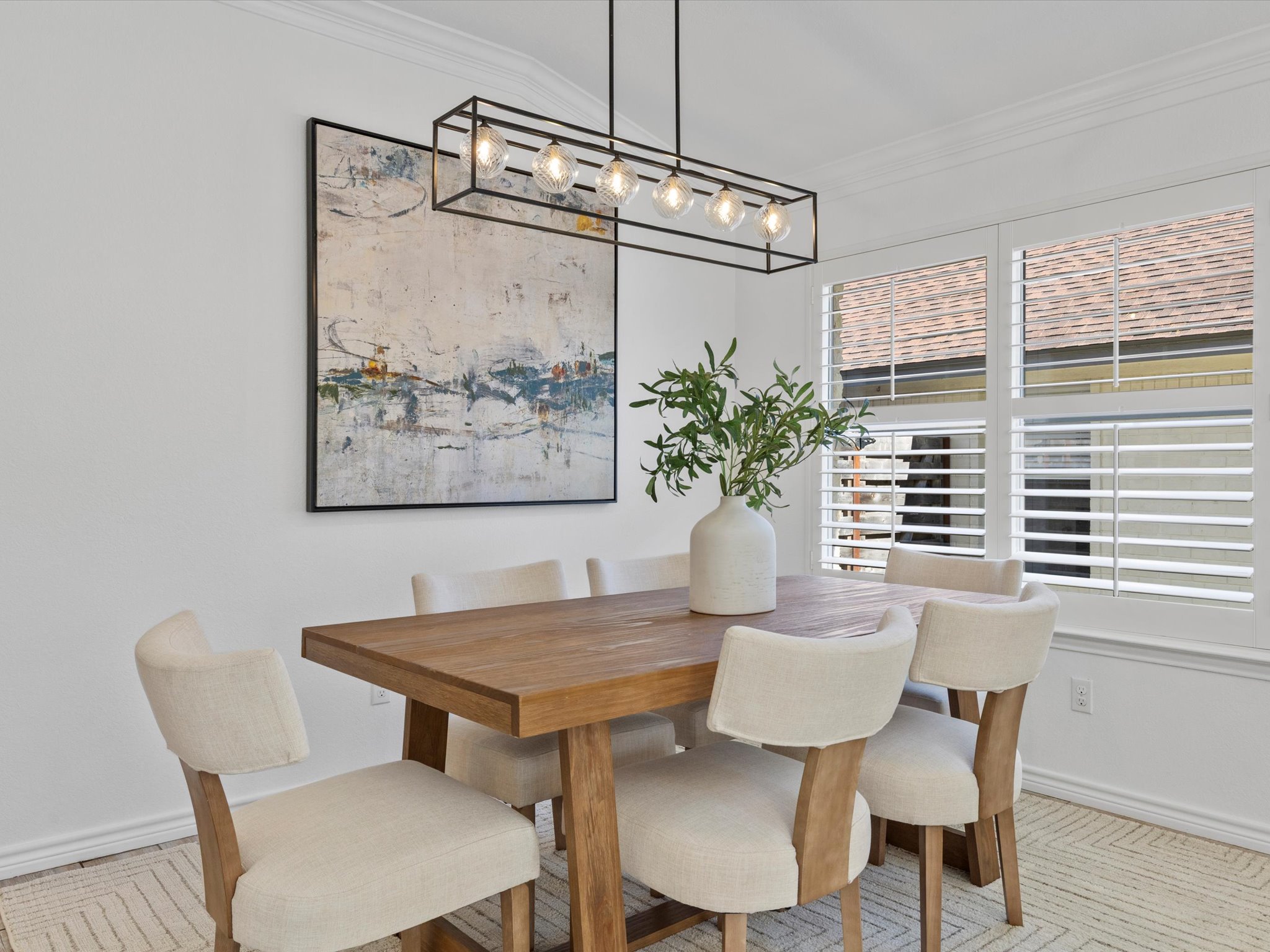 9322 Lightwood Loop Austin, TX 78748 - Photo 12 of 40 The formal dining room features a sleek & stylish modern chandelier for illuminating your dinner parties.