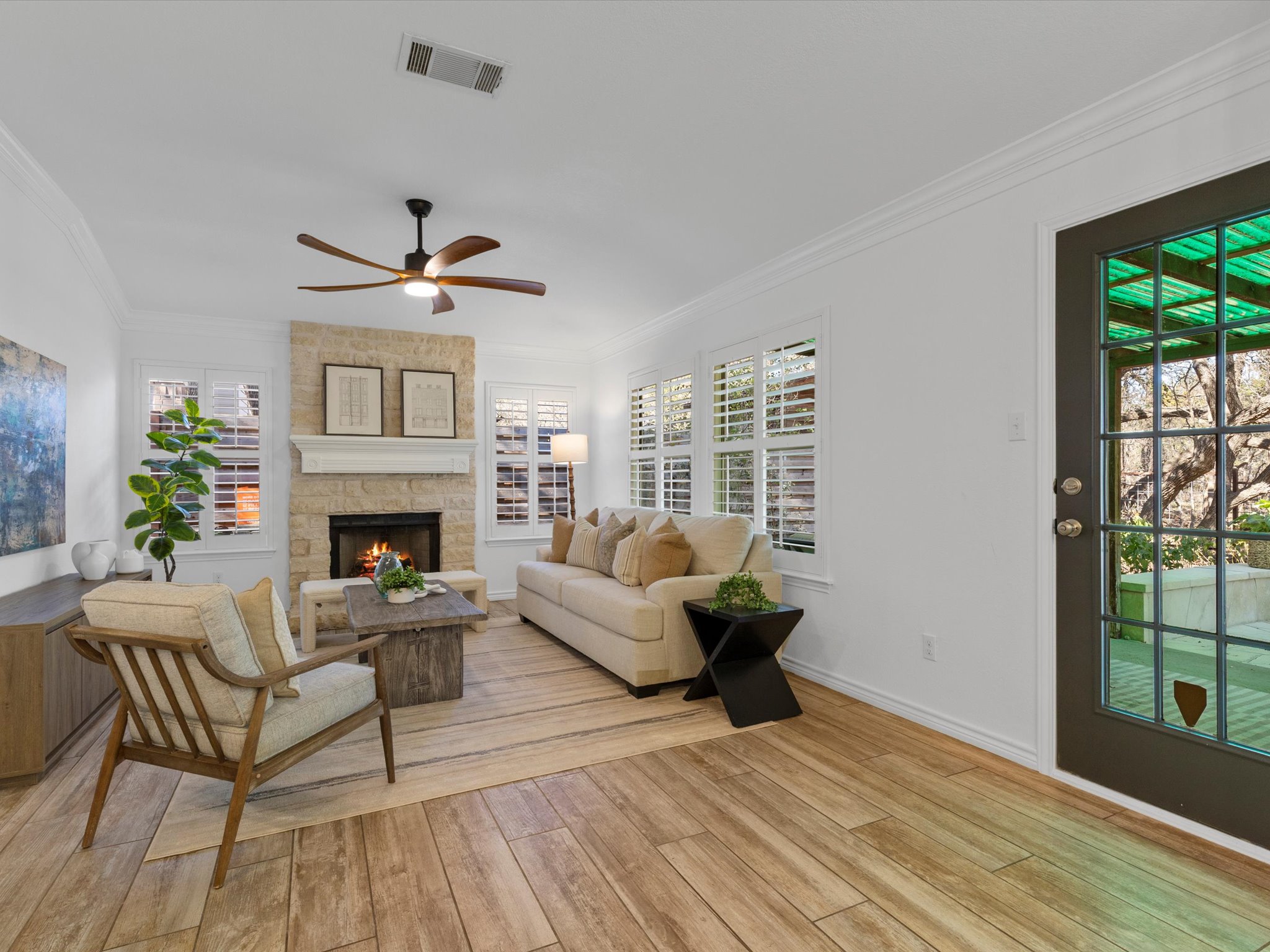 9322 Lightwood Loop Austin, TX 78748 - Photo 18 of 40 The family room centers around a cozy gas log fireplace, which sets a relaxing atmosphere for relaxing at the end of a long day.