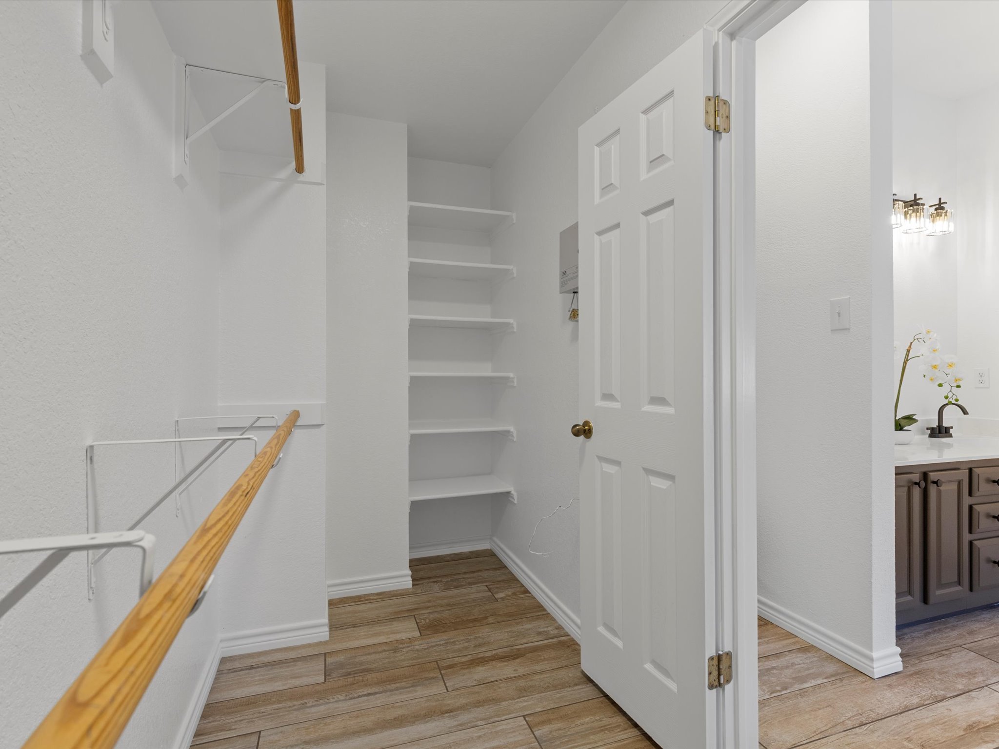 9322 Lightwood Loop Austin, TX 78748 - Photo 24 of 40 The walk-in closet is the star of the show with two sides and built-in shelving.