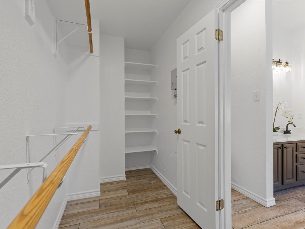 9322 Lightwood Loop Austin, TX 78748 - Photo 24 of 40 The walk-in closet is the star of the show with two sides and built-in shelving.