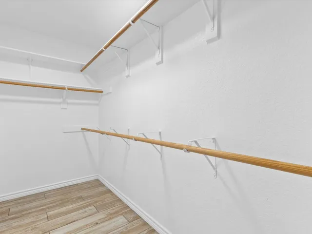 a view of an empty walk in closet