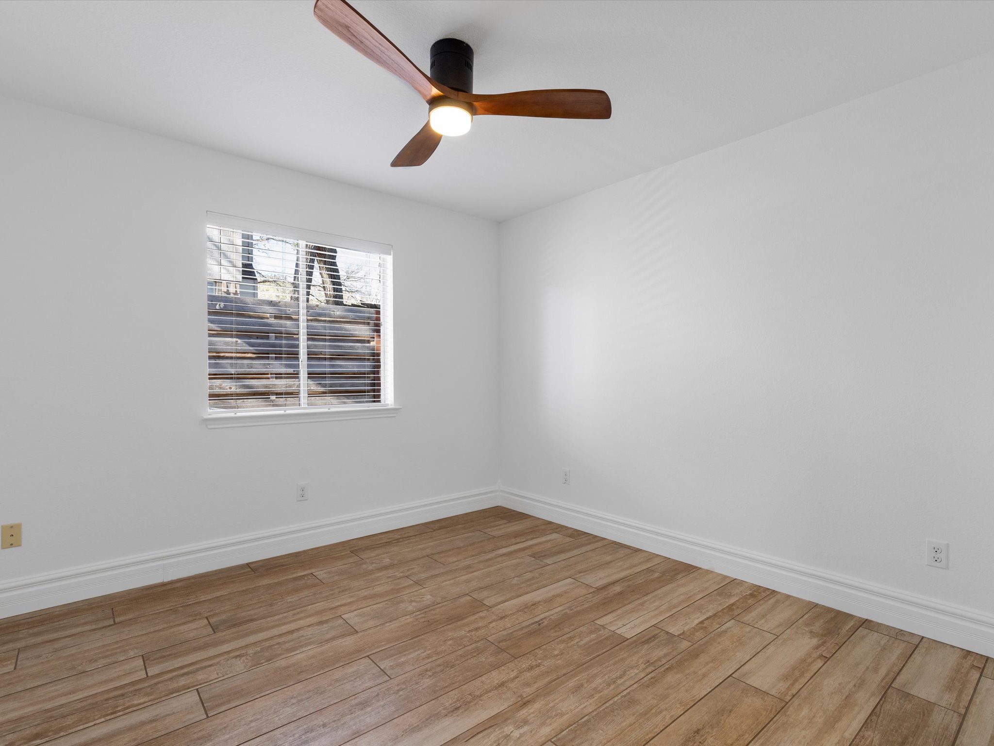 9322 Lightwood Loop Austin, TX 78748 - Photo 28 of 40 One of two dedicated secondary bedrooms, both of which come with modern ceiling fans and closet storage.