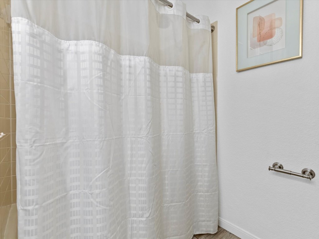 9322 Lightwood Loop Austin, TX 78748 - Photo 30 of 40 The secondary bath also has a walk-in shower with tile backsplash.