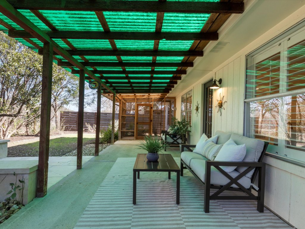 9322 Lightwood Loop Austin, TX 78748 - Photo 34 of 40 Enjoy relaxing and entertaining on the patio with unobstructed greenbelt views as your backdrop.