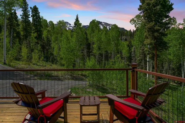 a view of a balcony with chairs