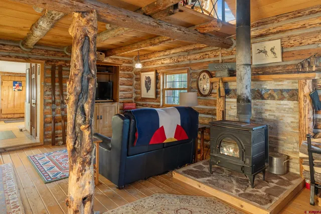 a view of living room with furniture and rug