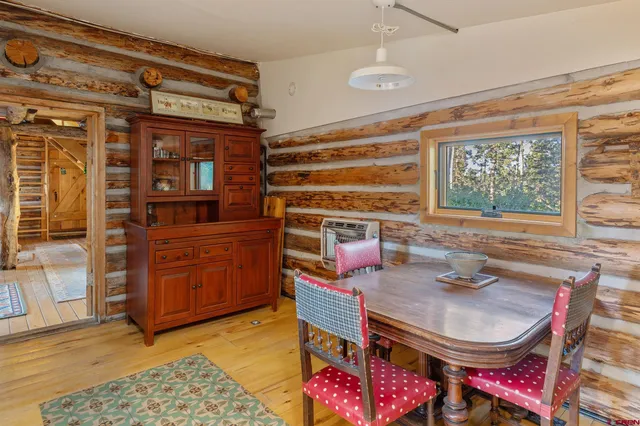 a reading room with furniture window and wooden floor