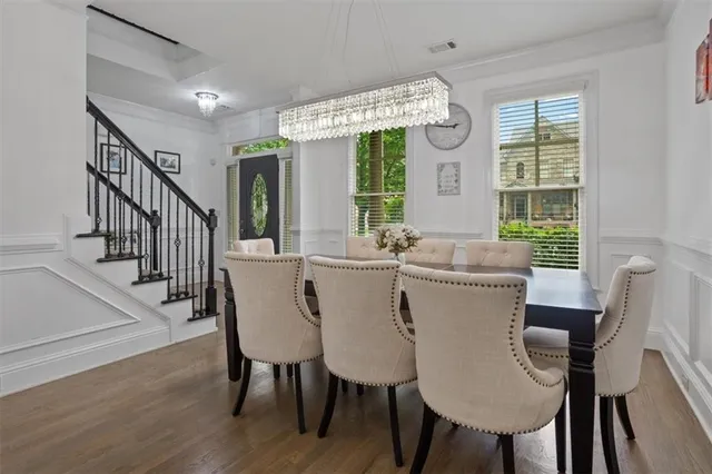 a kitchen with granite countertop a refrigerator stove and microwave