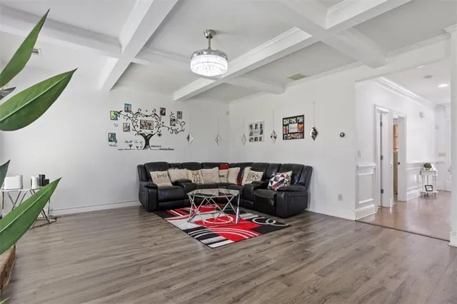 a dining room with furniture and wooden floor