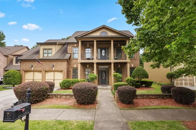 a front view of a house with garden
