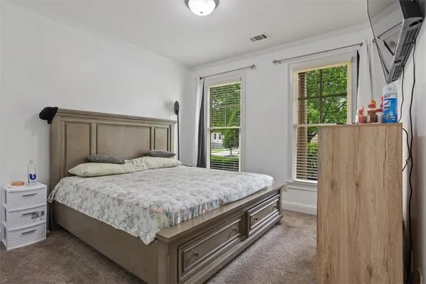 a bed room with a bed and a window