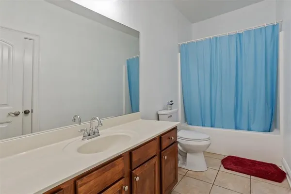 a bedroom with a bed and a cabinets