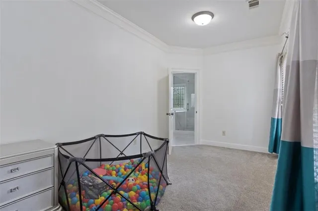 a spacious bathroom with a granite countertop sink a mirror a bathtub and shower