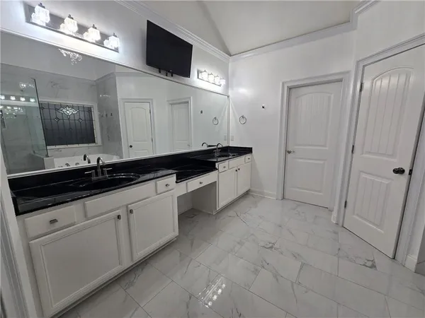 a view of a kitchen from the hallway