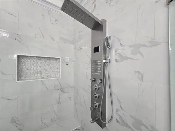 a white toilet sitting next to a bathroom sink