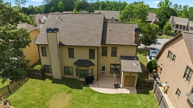 an aerial view of a house with outdoor space