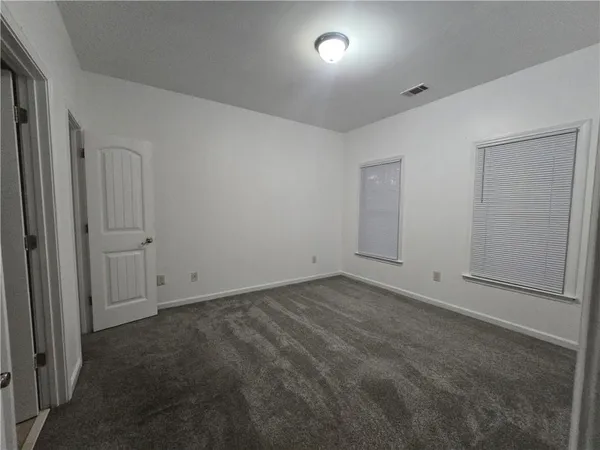 a view of multiple houses with a street