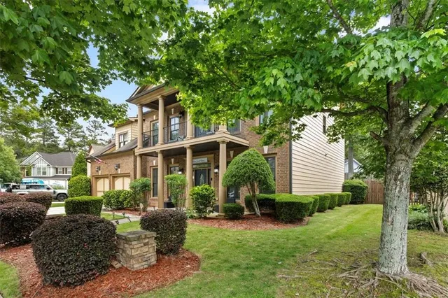 a front view of a house with a yard