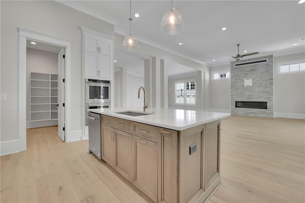 123 Candler Loop Acworth, GA 30101 - Photo 16 of 34 a kitchen with a sink refrigerator and cabinets