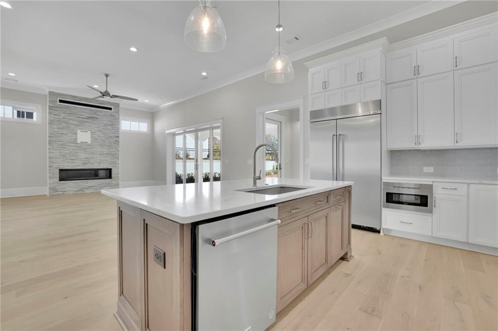 123 Candler Loop Acworth, GA 30101 - Photo 17 of 34 a kitchen with granite countertop kitchen island a sink appliances and cabinets