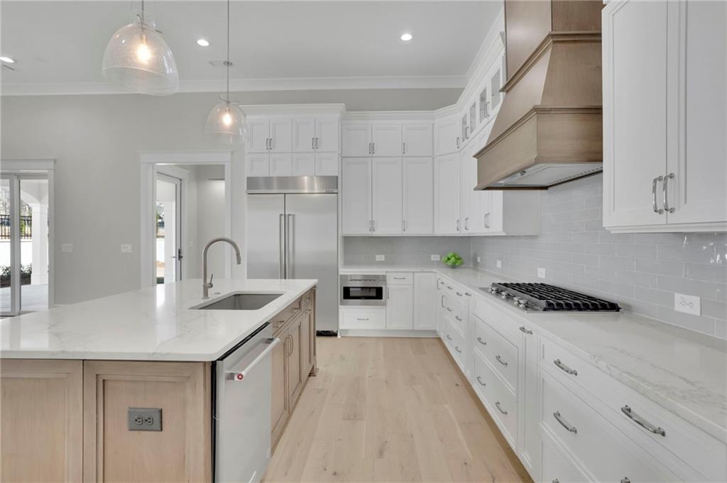 123 Candler Loop Acworth, GA 30101 - Photo 19 of 34 a kitchen with stainless steel appliances granite countertop a sink a stove and cabinets