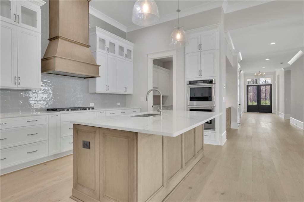 123 Candler Loop Acworth, GA 30101 - Photo 22 of 34 a kitchen with stainless steel appliances a sink stove and cabinets