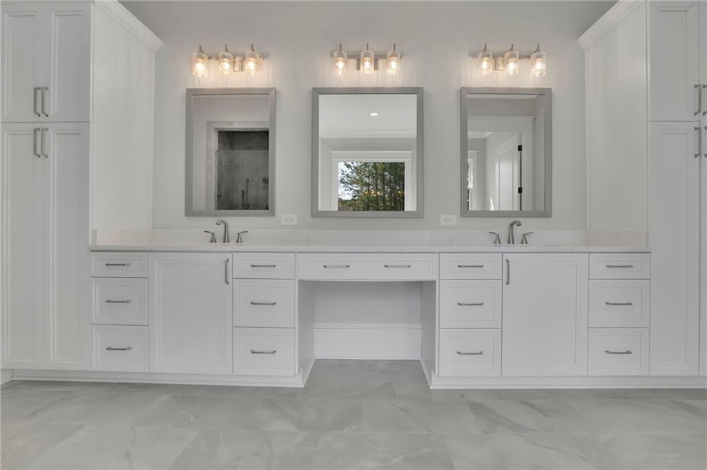 123 Candler Loop Acworth, GA 30101 - Photo 25 of 34 a bathroom with white cabinets and a sink