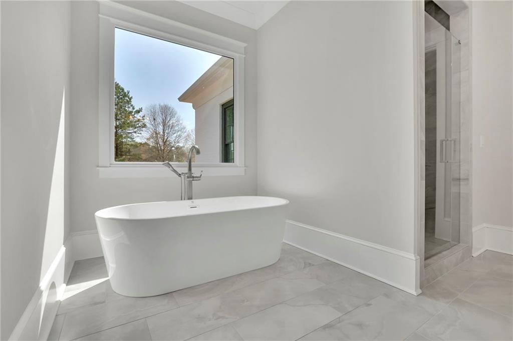 123 Candler Loop Acworth, GA 30101 - Photo 26 of 34 a white bath tub sitting in a bathroom