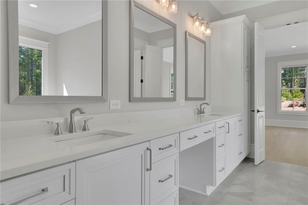 123 Candler Loop Acworth, GA 30101 - Photo 30 of 34 a bathroom with double sink and a mirror